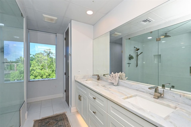 bathroom with vanity, tile patterned floors, and an enclosed shower