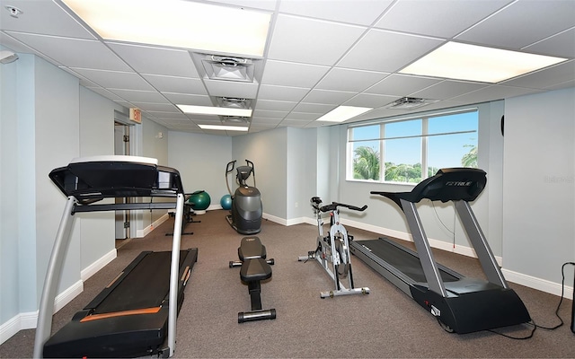 workout room with a drop ceiling