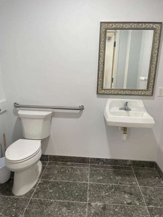 bathroom featuring toilet and sink