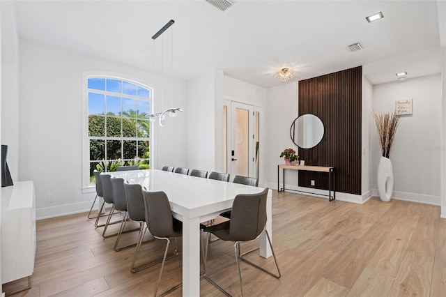 dining area with light wood-type flooring