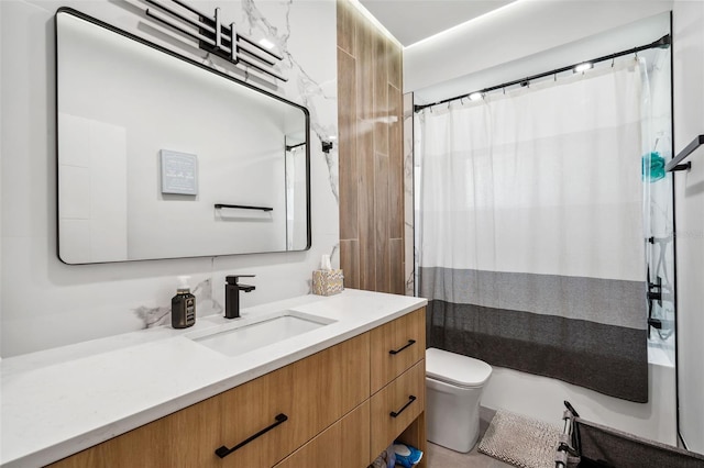 full bathroom with vanity, toilet, and shower / bath combo with shower curtain