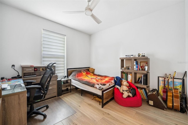 office space featuring ceiling fan and light hardwood / wood-style floors