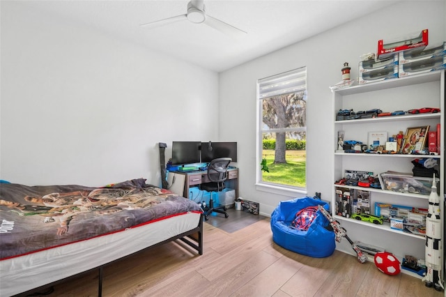 bedroom featuring light hardwood / wood-style flooring and ceiling fan