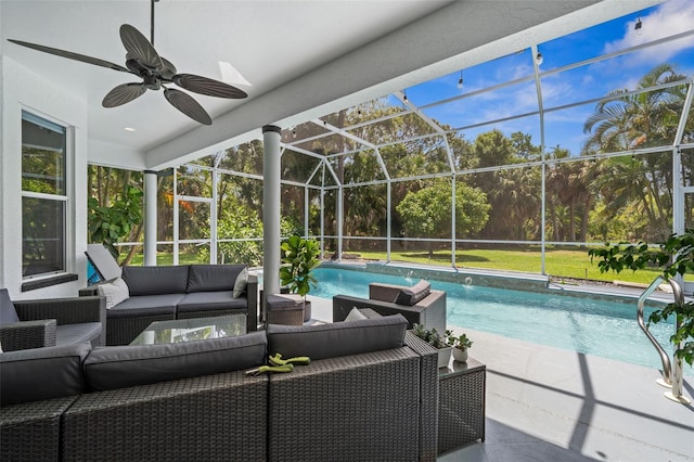 view of swimming pool featuring an outdoor living space, ceiling fan, glass enclosure, and a patio area