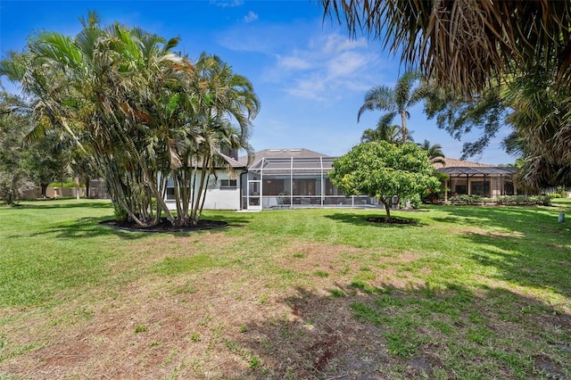 view of yard featuring a lanai