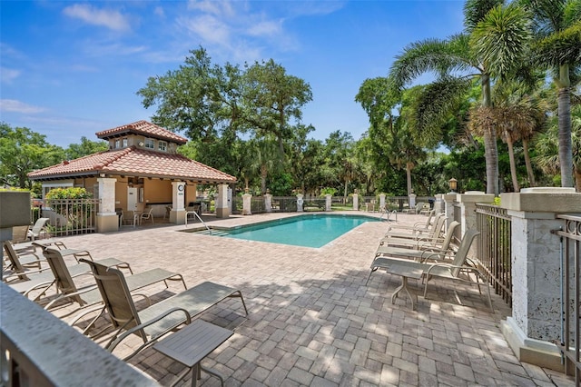 view of swimming pool with a gazebo and a patio