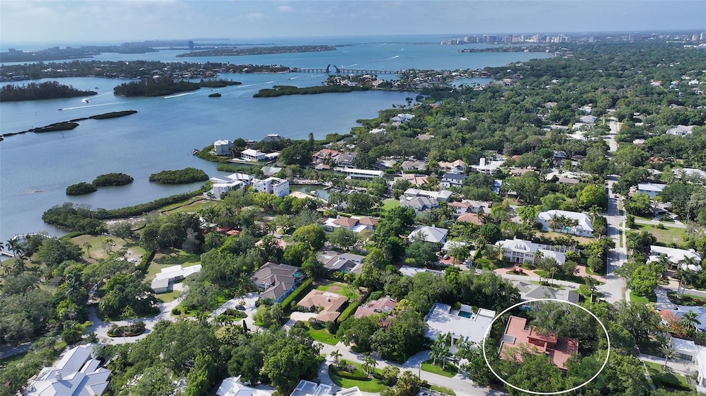 birds eye view of property with a water view