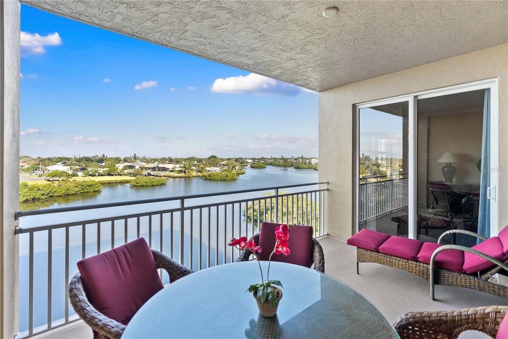 balcony featuring a water view