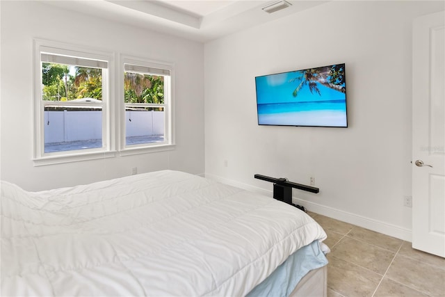 bedroom featuring light tile patterned floors