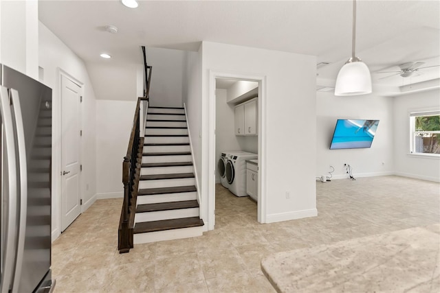 stairs featuring ceiling fan and washer and dryer