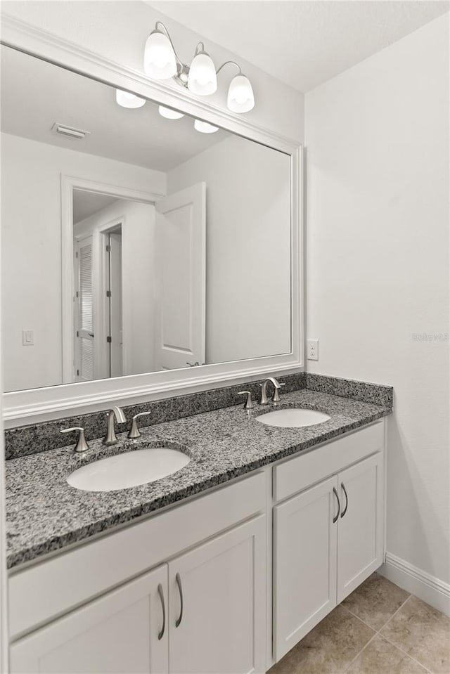 bathroom featuring vanity and tile patterned flooring