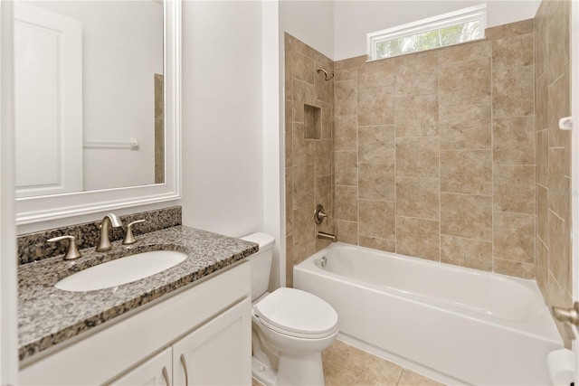 full bathroom with tiled shower / bath combo, vanity, and toilet