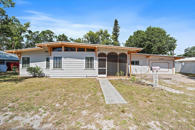 ranch-style house with a front yard