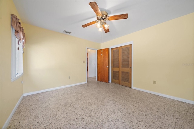 unfurnished bedroom with a closet and ceiling fan