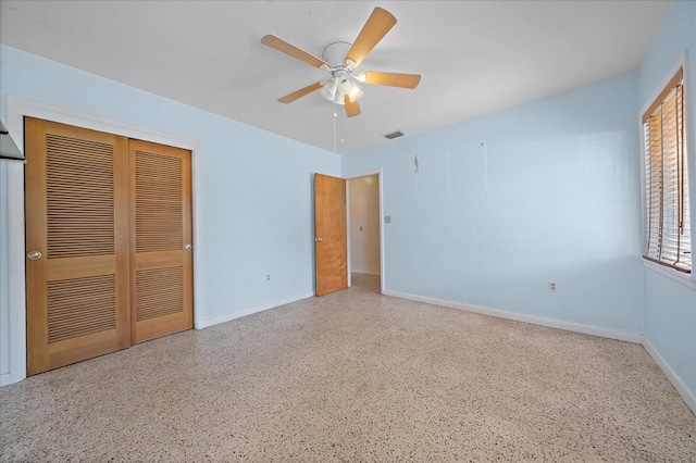 unfurnished bedroom featuring a closet and ceiling fan