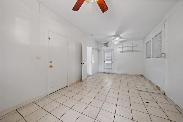 tiled spare room with ceiling fan