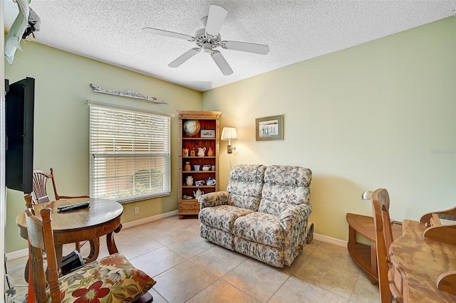 office space featuring ceiling fan, tile flooring, and a textured ceiling