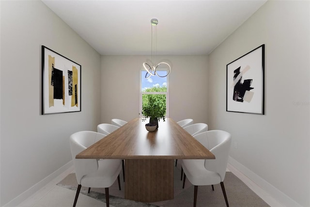 dining space featuring tile flooring and a notable chandelier