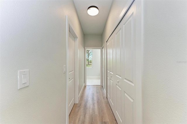 corridor featuring light hardwood / wood-style floors