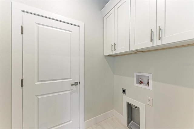 washroom featuring cabinets, light tile flooring, washer hookup, and electric dryer hookup