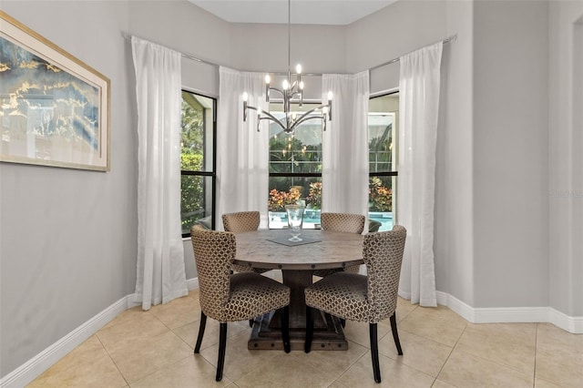 dining room featuring a notable chandelier and light tile patterned floors