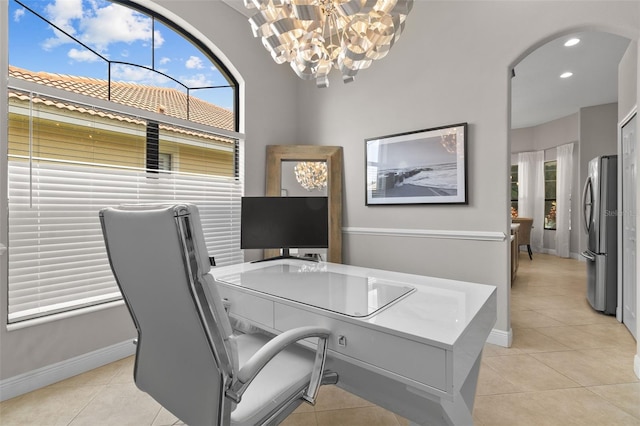 office space featuring light tile patterned floors and a chandelier