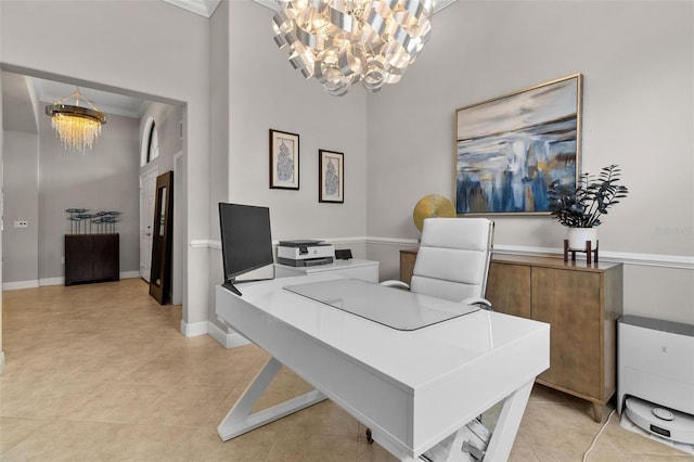 home office featuring a towering ceiling, light tile patterned floors, a chandelier, and ornamental molding