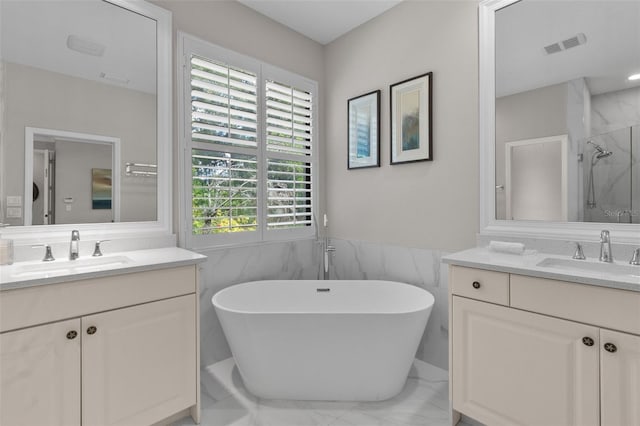 bathroom featuring vanity, tile walls, and independent shower and bath