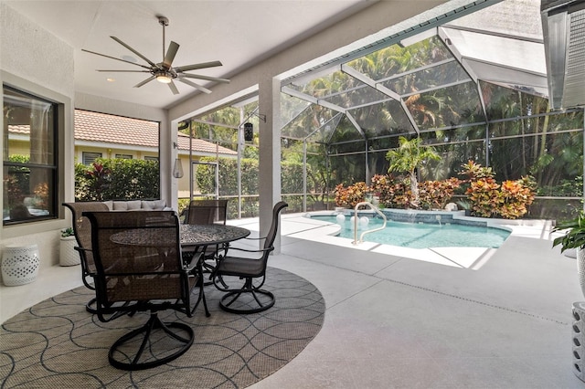 view of pool with ceiling fan, a lanai, and a patio