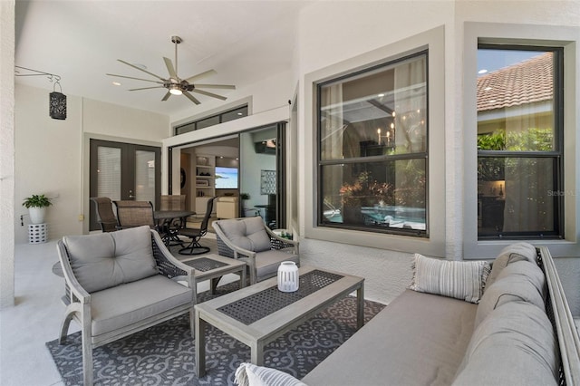 view of patio / terrace with an outdoor living space and ceiling fan