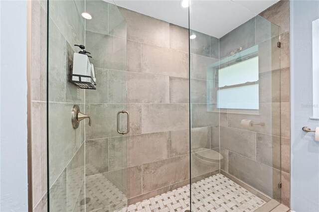 full bathroom featuring a shower stall