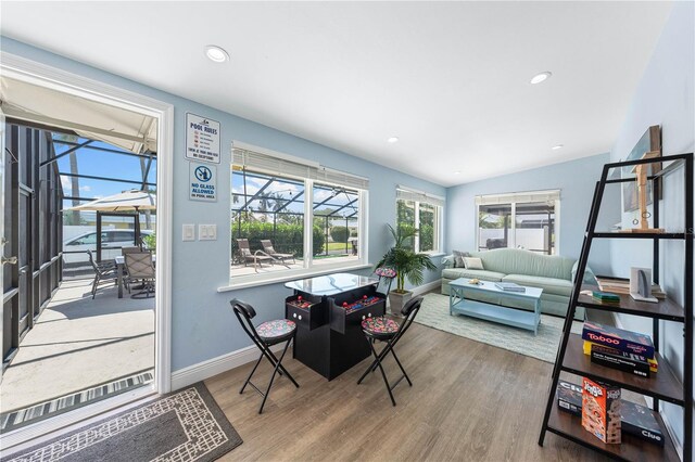 interior space with recessed lighting, baseboards, and wood finished floors