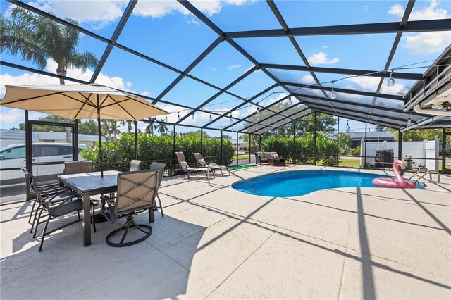 view of swimming pool featuring a fenced in pool, a lanai, and a patio