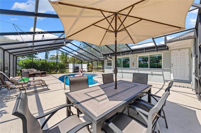 view of patio with a fenced in pool, glass enclosure, and an outdoor hangout area