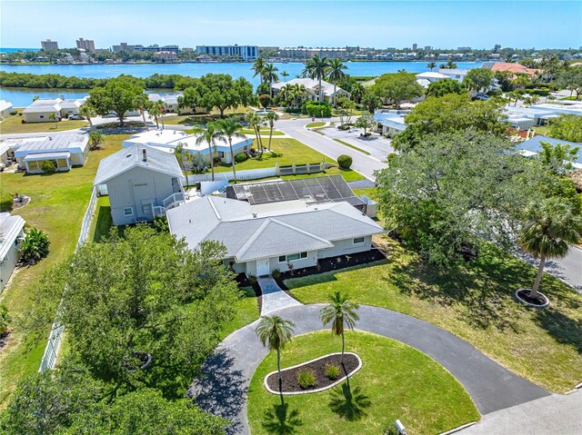 birds eye view of property with a view of city, a water view, and a residential view