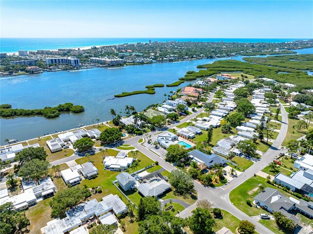 drone / aerial view with a water view and a residential view