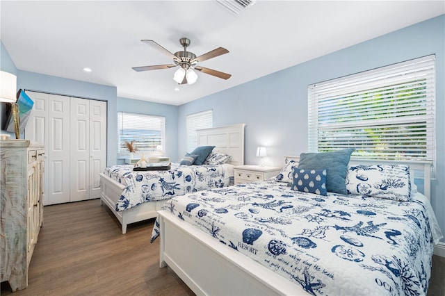 bedroom with dark wood finished floors, recessed lighting, a closet, visible vents, and ceiling fan