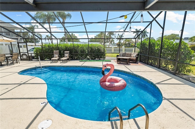 pool with glass enclosure, a patio area, and an outdoor living space