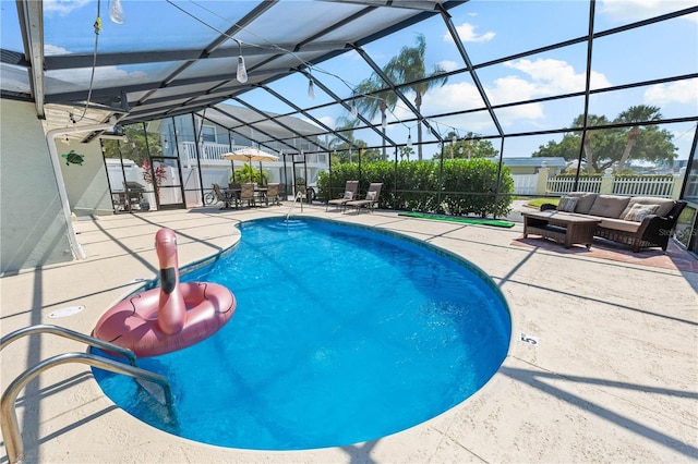 view of swimming pool featuring a fenced in pool, a patio, a lanai, fence, and an outdoor living space