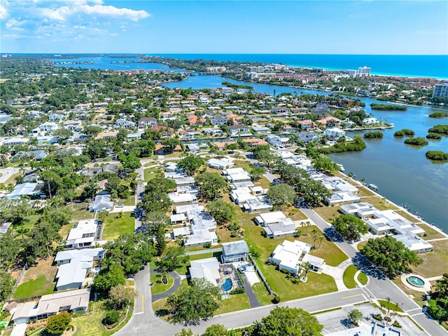 bird's eye view featuring a water view and a residential view