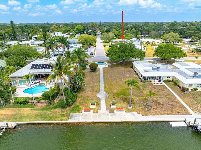 bird's eye view featuring a residential view and a water view