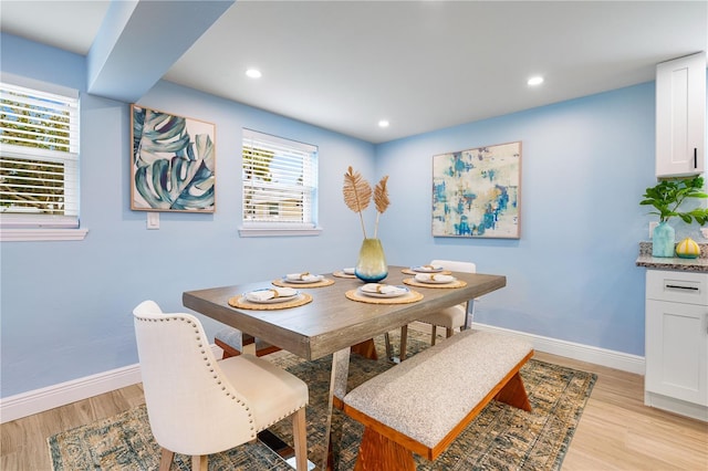 dining area featuring light wood-type flooring, baseboards, and recessed lighting