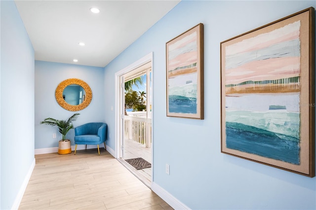 entryway featuring baseboards, recessed lighting, and light wood-style floors