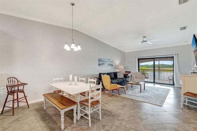 tiled dining area with ornamental molding, ceiling fan with notable chandelier, and high vaulted ceiling