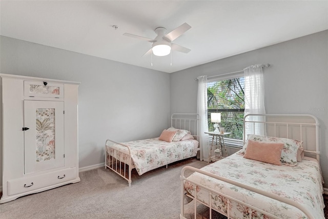 bedroom with ceiling fan and carpet floors