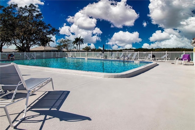 view of swimming pool featuring a patio