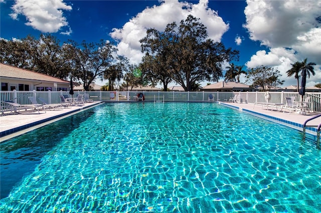 view of swimming pool with a patio