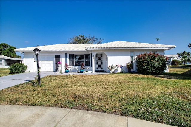 ranch-style house with a front yard and a garage