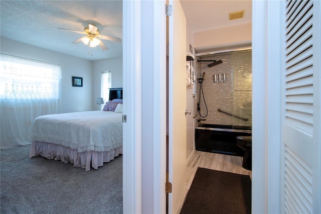 bedroom featuring ceiling fan and light carpet