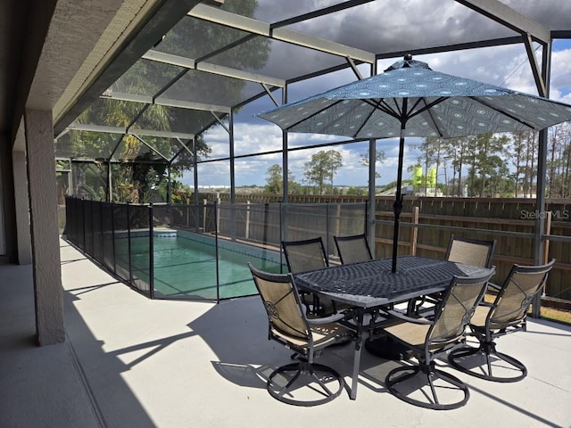 view of patio / terrace with a fenced in pool and a lanai